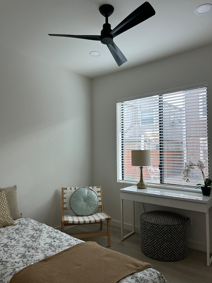 Bedroom 2: Full size bed, small night stand, full size desk. Large closet. Natural light through large window that overlooks the shared yard.