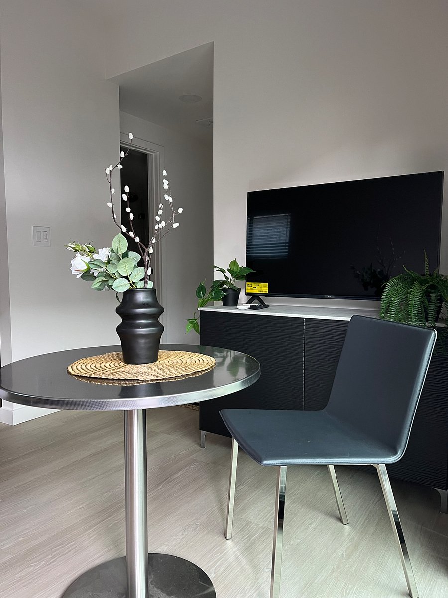 Living space has the TV, TV console with storage, 29 inch rough dining table for 1-2 persons, 80 inch sofa, round coffee table. Living room is open to the kitchen, and has large sliding door out to the 120 sq foot patio.