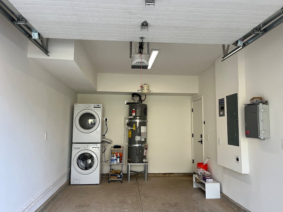 Washer and dryer, water heater located in private, attached single car garage. EV charger located in garage.