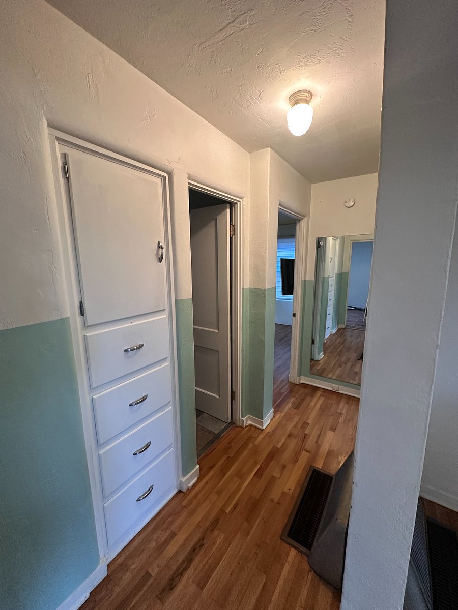 Hallway towards bathroom and guest rooms. Holds plenty of storage. 