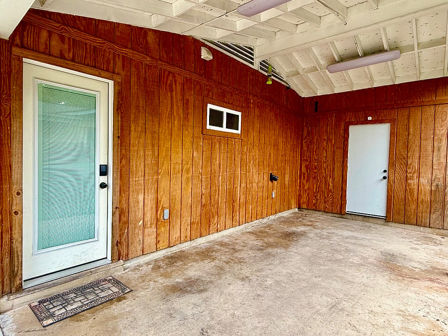 Carport with entry via keypad to the kitchen. Laundry room at the end