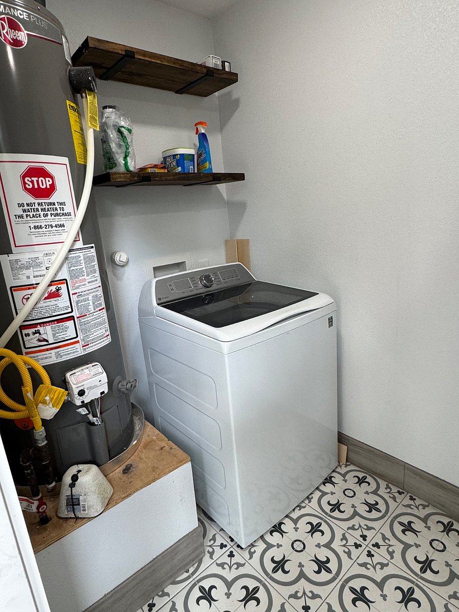 Laundry room off the carport with washer and dryer. Drying rack and iron are also available.