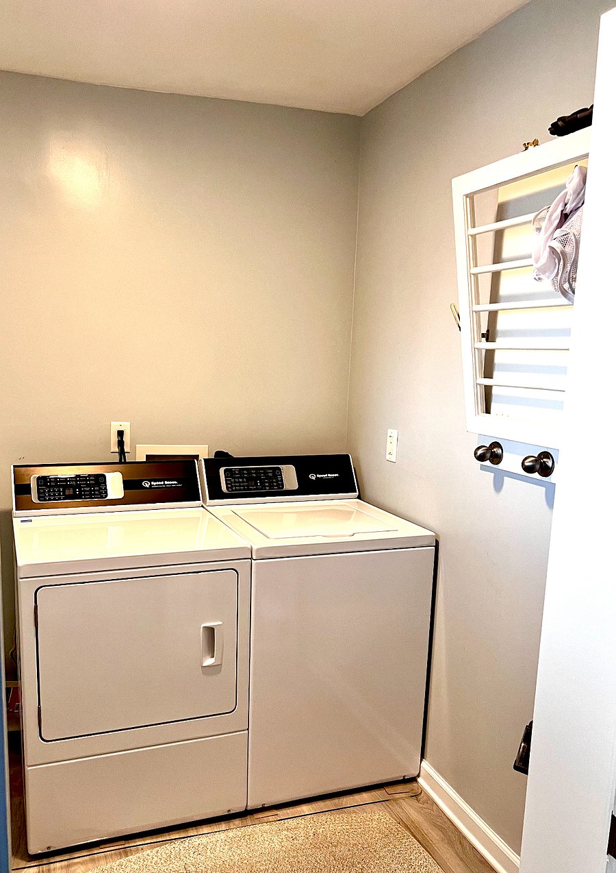Laundry room with brand new Speed Queen washer and dryer