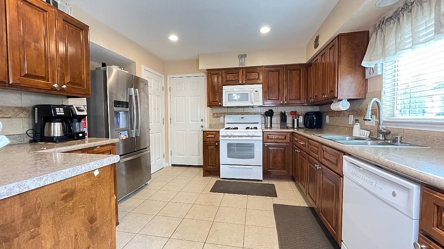 Kitchen gas stove, fridge with ice maker, dishwasher, bar height counter.jpeg