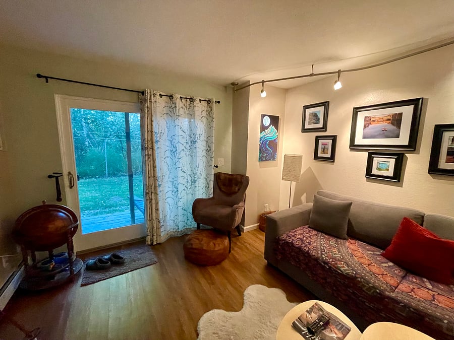 Sliding glass door to the backyard. Lounge chairs on the back porch.
