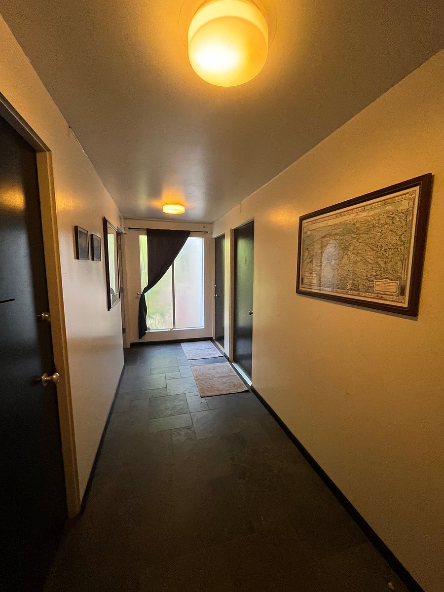 Hallway on 2nd Floor, showing doors to Unit 3 (back right beside window) and Unit 4 (middle right).