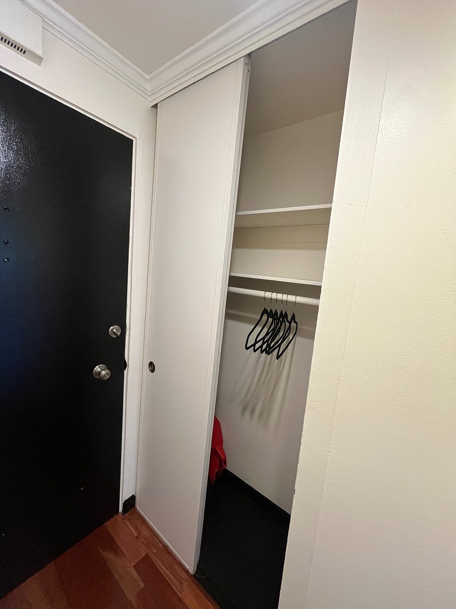Internal hallway closet inside the front door to the apartment. Closet features sliding doors for easy access.