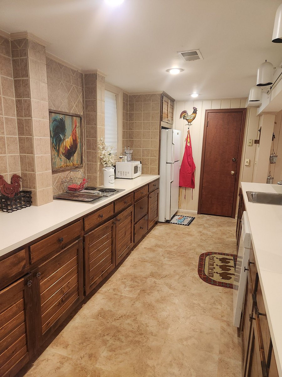 Full kitchen with double ovens, electric burners, dishwasher, full size refrigerator