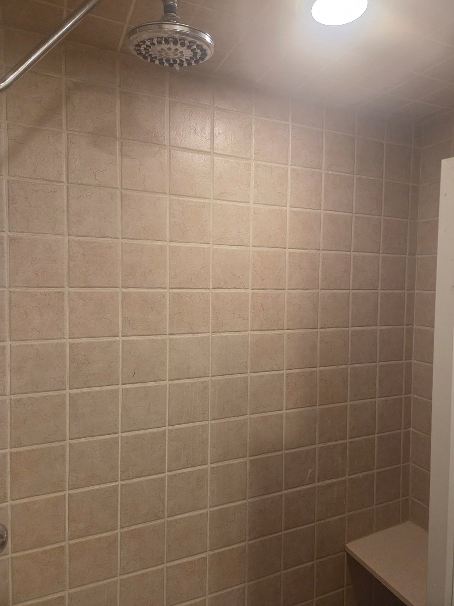 Large walk in shower with built in bench