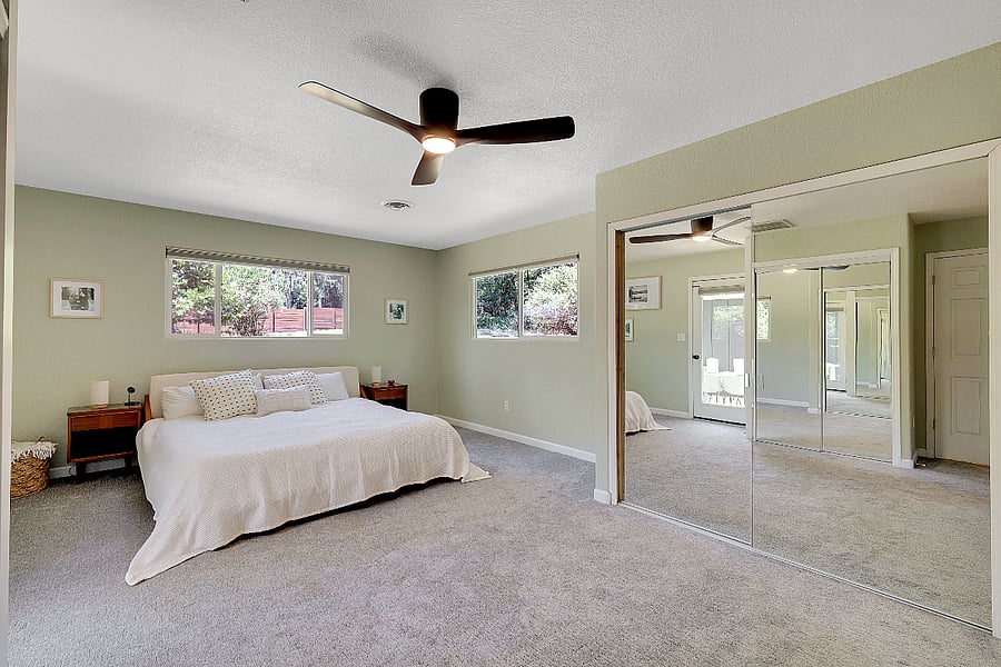 Primary bedroom, with ensuite bathroom and separate patio entrance