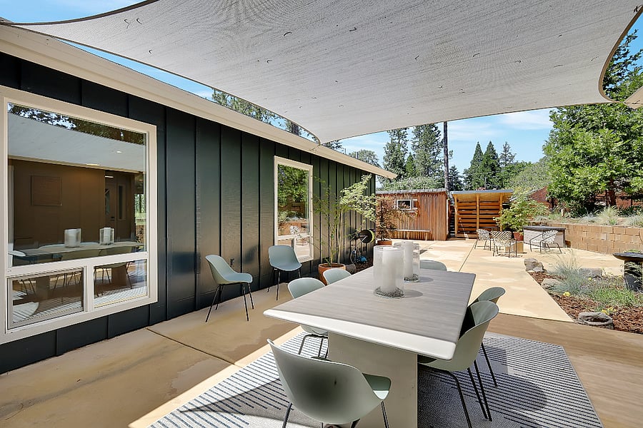 Outdoor table off the kitchen and primary bedroom