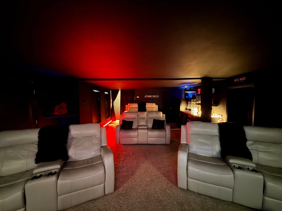 Movie room with 4 double recliner seats that seat 8 people 