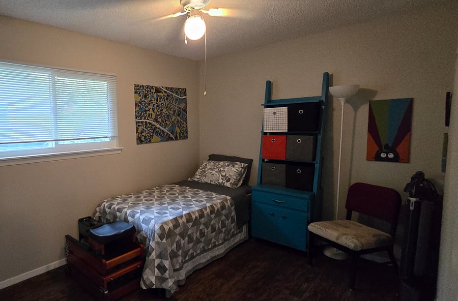 Guests room and home gym. The twin beds are stacked - they can be unstacked for more sleeping areas. There is plenty of floor space for working out, a fold-up treadmill in the right corner and a fold-up rowing machine at the foot of the bed.