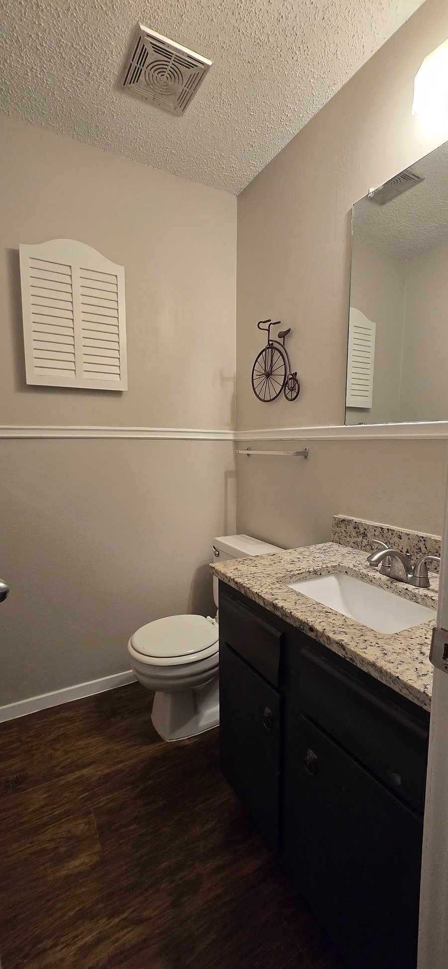 Private half bath attached to the primary bedroom.