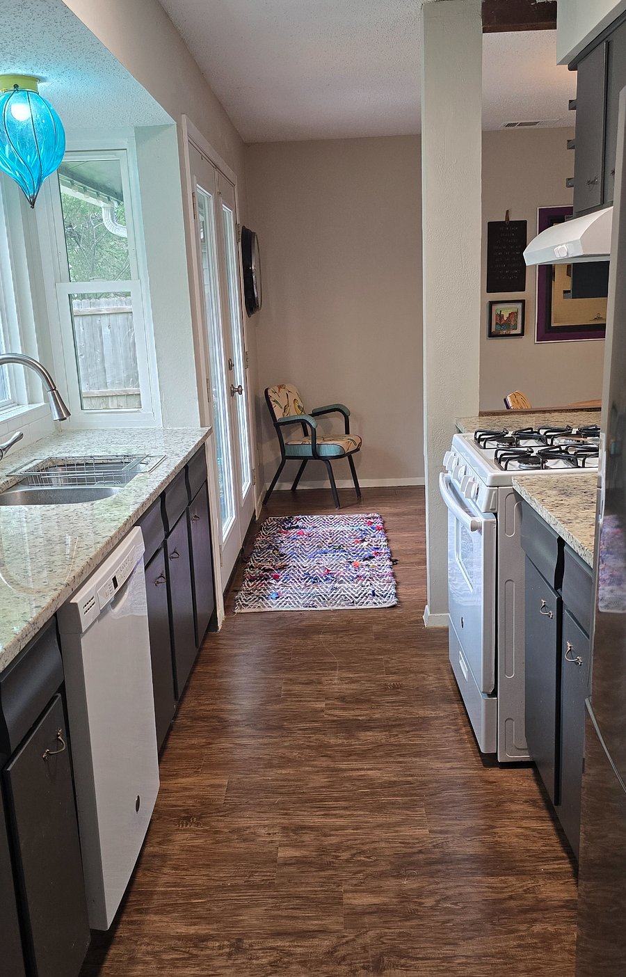 The galley kitchen connects the dining and utility rooms.