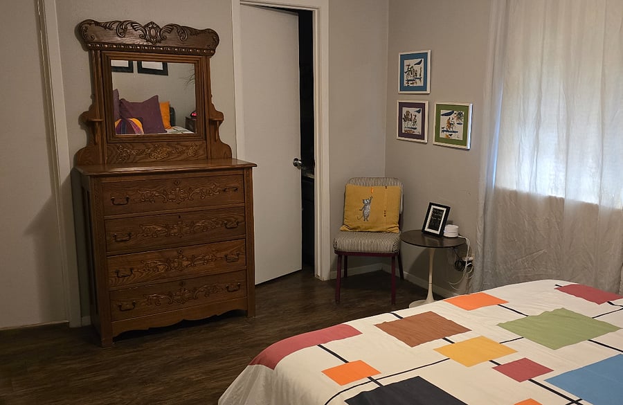 Primary bedroom has a reading corner and access to both the full and half bath.