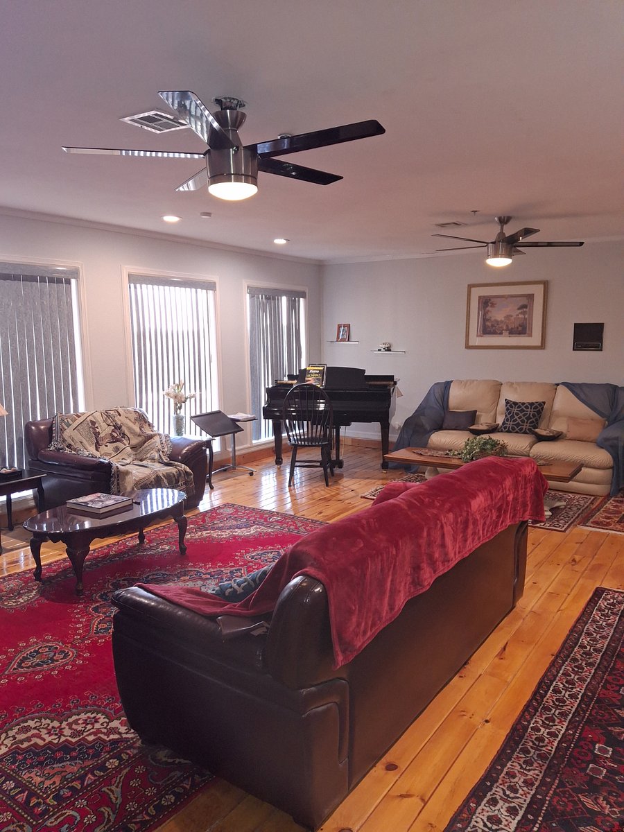 Living room with piano.