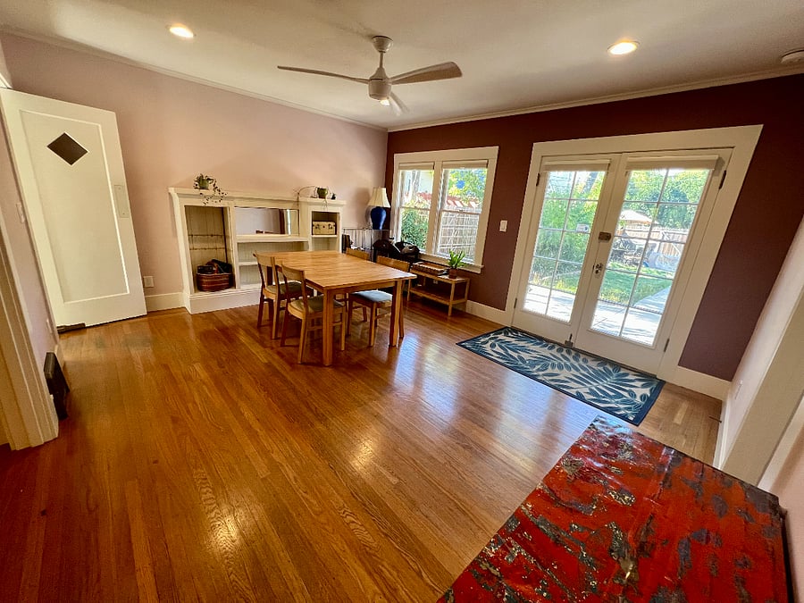 Dining Room opens into the backyard. Built-in cabinets throughout the house including the dining room. Lots of windows and natural light!