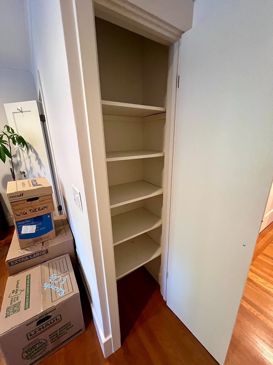 In addition to a large walk-in closet, the primary bedroom has an additional closet space that can function as a dresser.