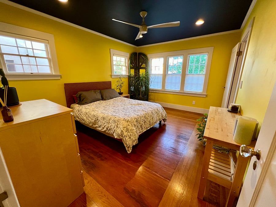 The guest bedroom windows provide lots of light and full length, two-way window shades can quickly be adjusted to enhance privacy or keep out the morning sun.