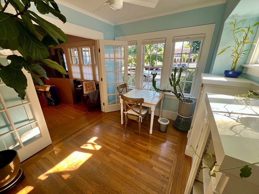 Cafe table in the blue room can be used as a home office or breakfast table.