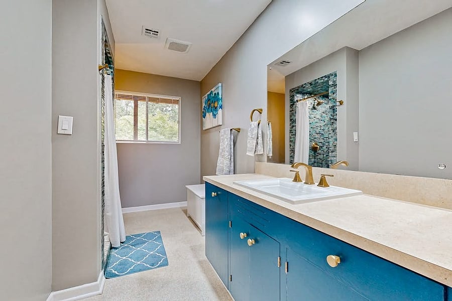 Downstairs bathroom with separate water heater.