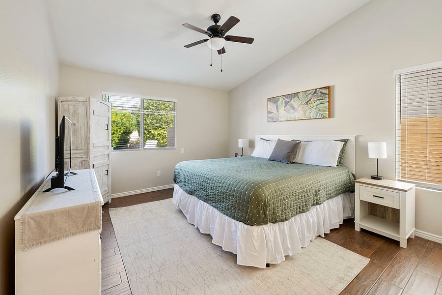 Primary Bedroom with a King bed, tv, 2 nightstands and ensuite