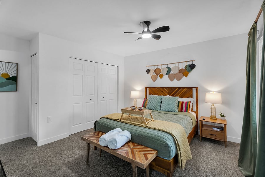 master bedroom with en suite bathroom and TV. 