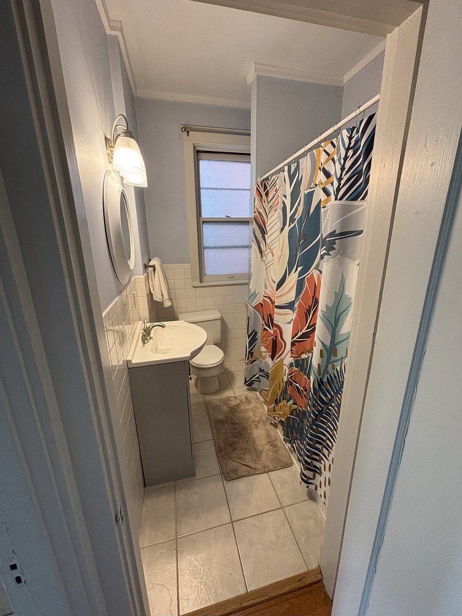 Bathroom with shower/bath combo and lots of storage
