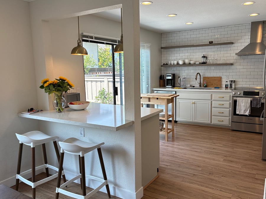 Bar stools, kitchen, sliding glass door to patio