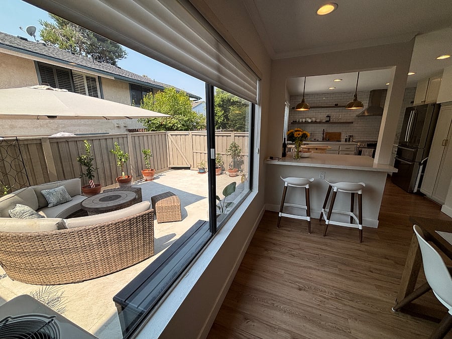 Patio through window, bar stools