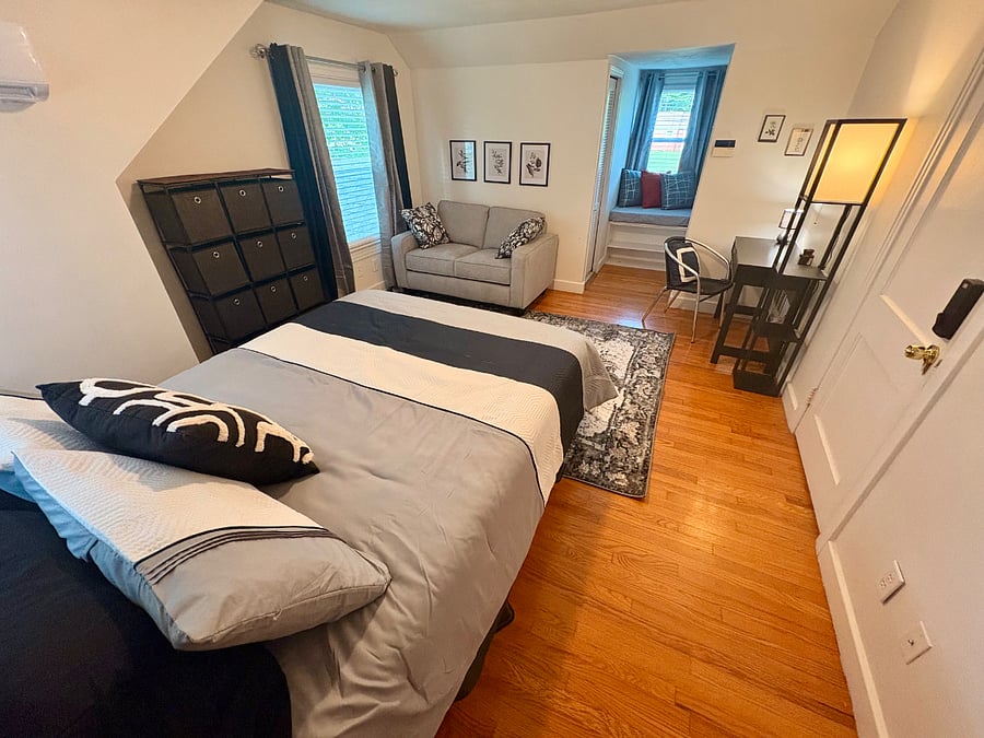 Bedroom #3 - queen bed, multiple closets, mini-split for personalized heating and cooling, desk, loveseat and cozy dormer area for reading and dreaming
