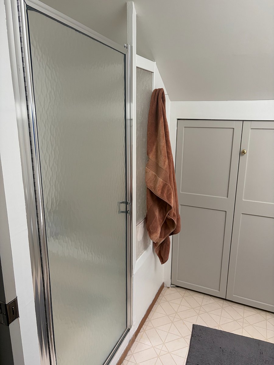 This bathroom has a shower with good water pressure.