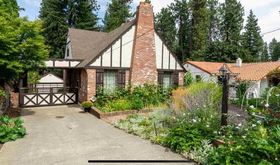 Driveway leads to the covered carport and entrance to the back studio apartment.