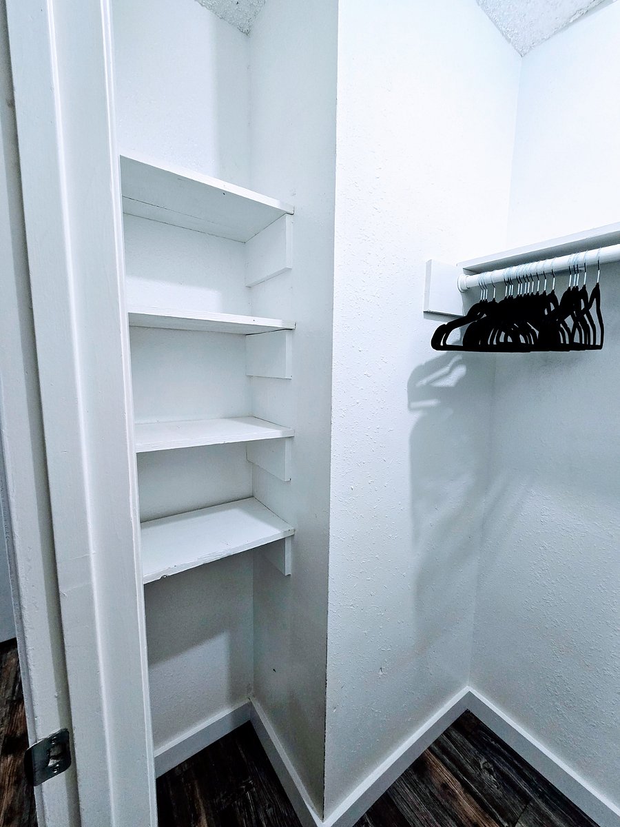 Bedroom 1 closet with built in shelving