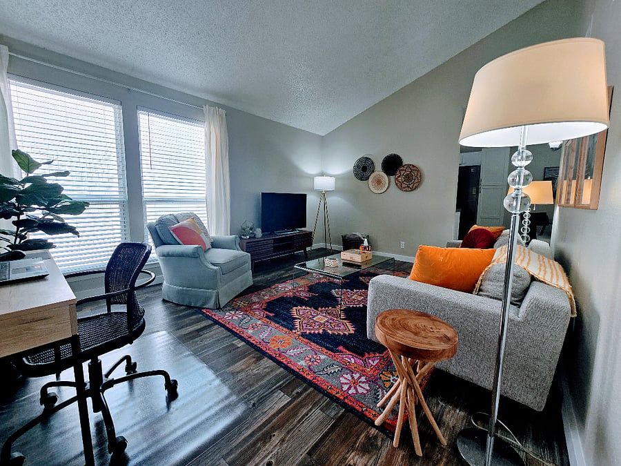 Living room with vaulted ceiling and workstation