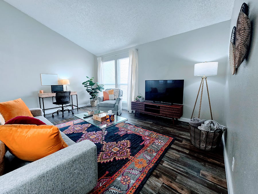 Living room with vaulted ceiling and workstation