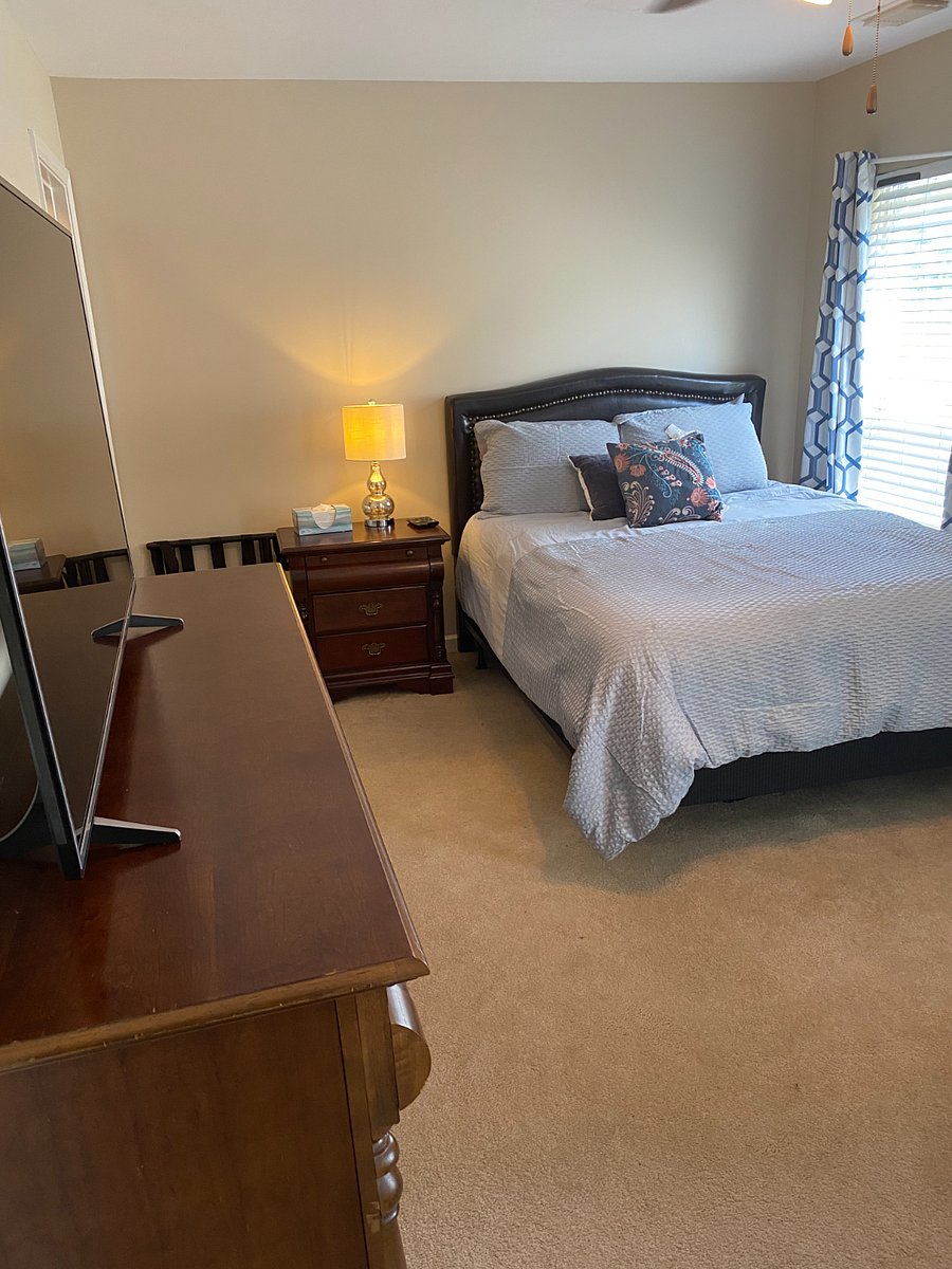 Queen Bed 
Large bedroom contains a queen bed and an adjustable full bed.