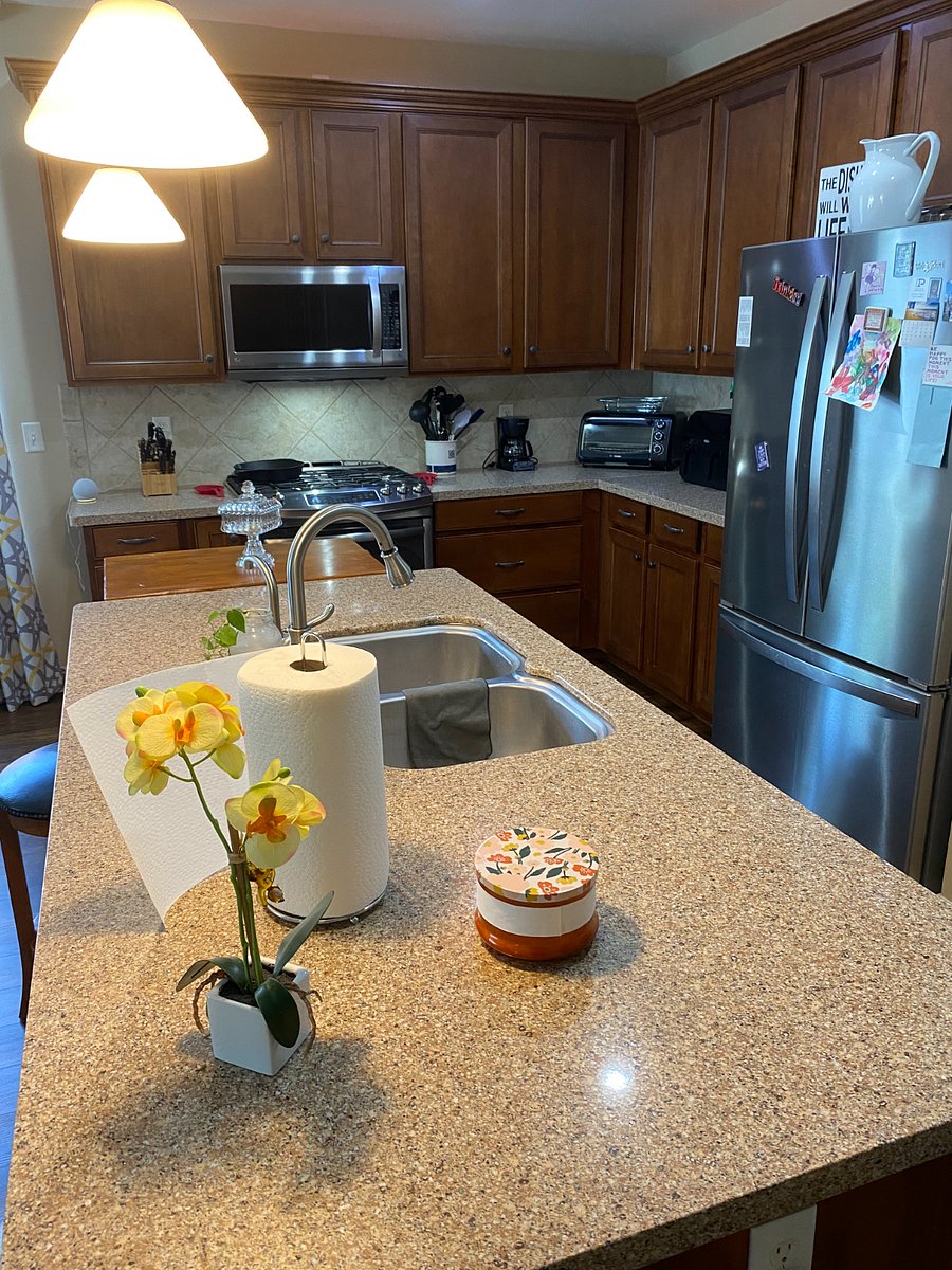 Shared kitchen is fully stocked with modern appliances and gadgets. 