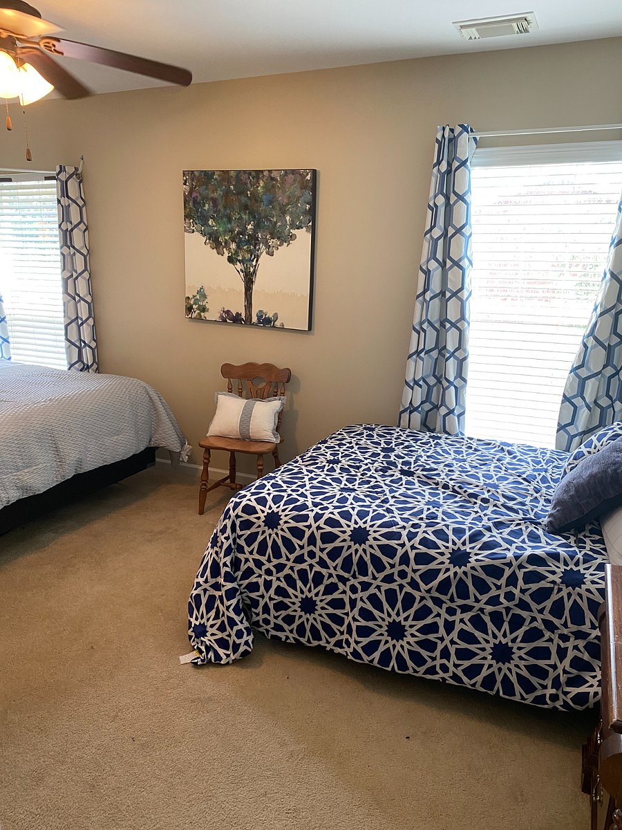 
Large bedroom contains a queen bed and an adjustable full bed. 