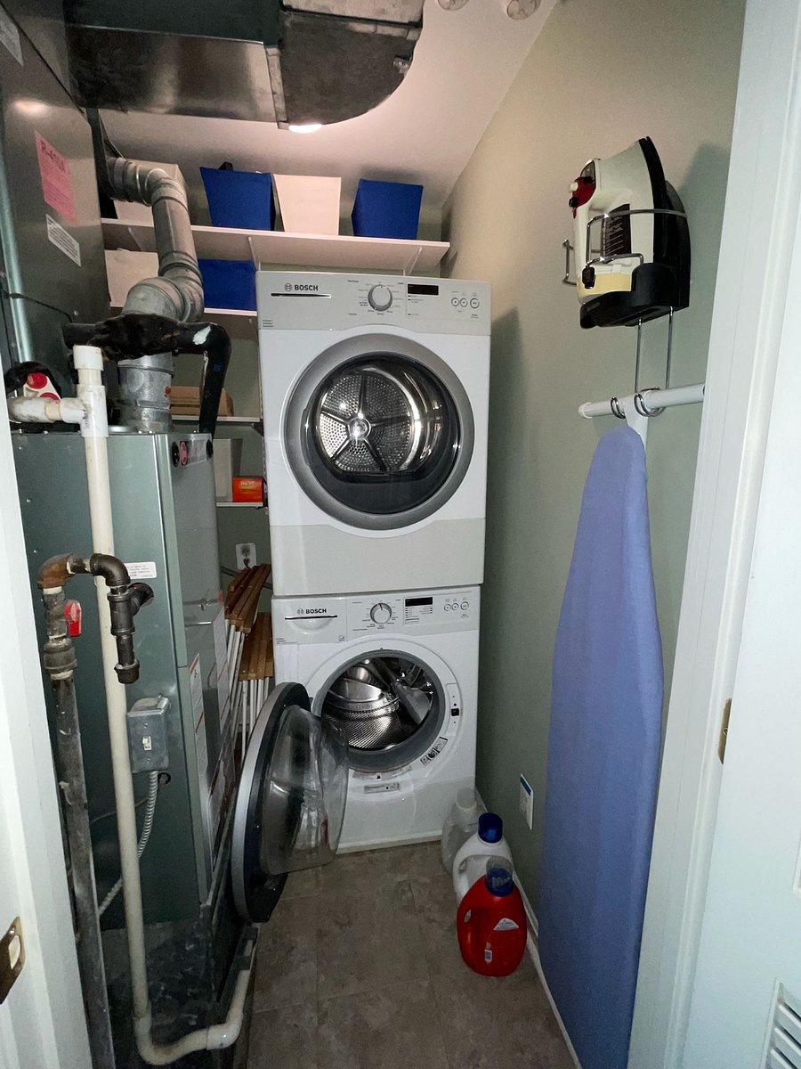 Shared washer, dryer, ironing board and iron