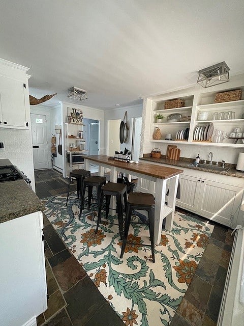 Kitchen with Keurig and microwave. No dishwasher.