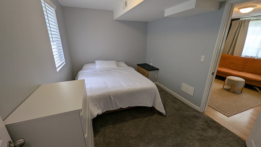 Your Bedroom opens into the living room space.