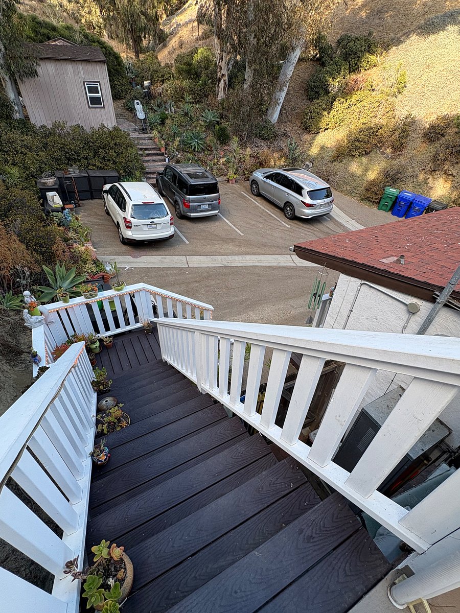Stairs from deck showing parking area