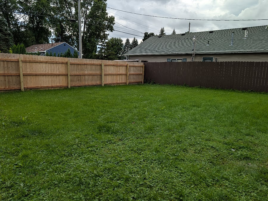 Back yard, fully fenced, garage service door accessible from inside fenced area.