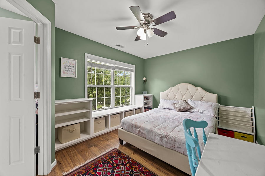 The Deer: Bedroom 1 with lush green trees outside, beautiful view of sunsets.