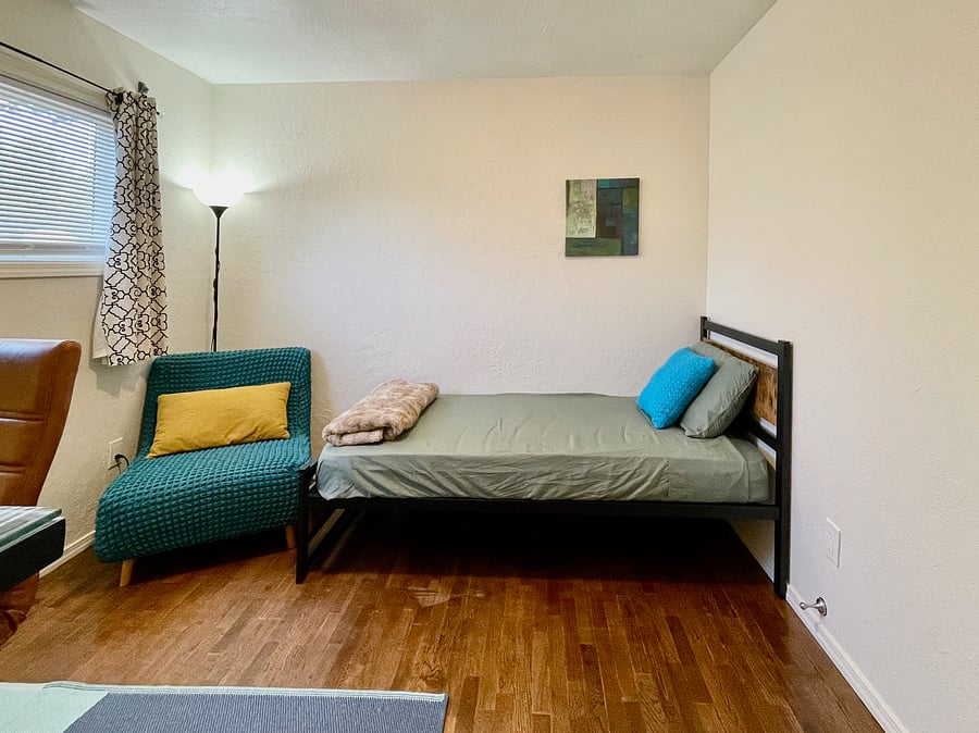 Flex room with workstation and twin XL bed.
