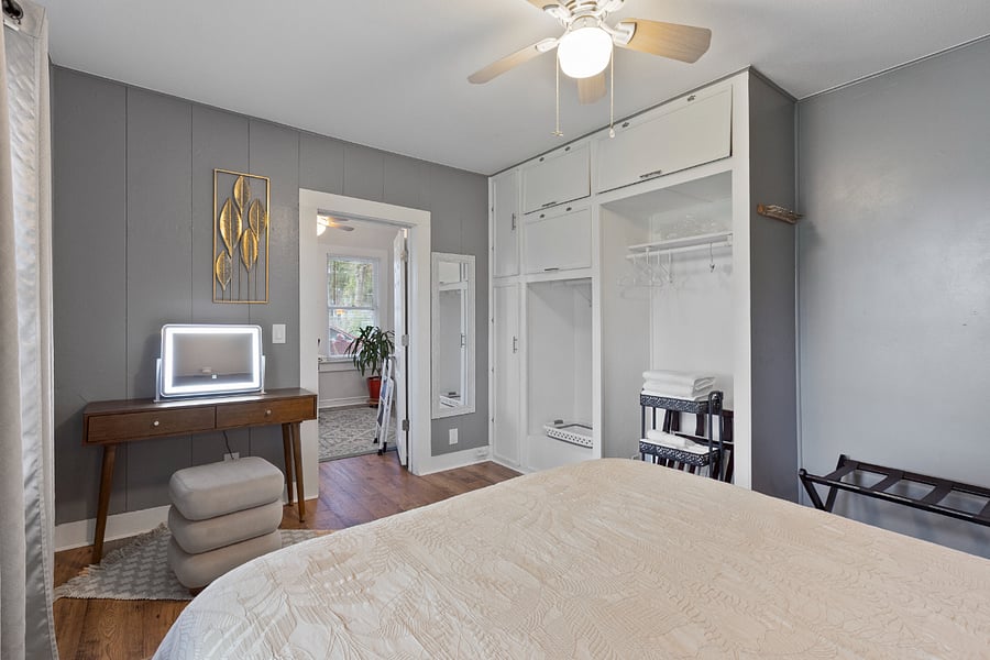 Both bedrooms have their own towel cart and laundry basket