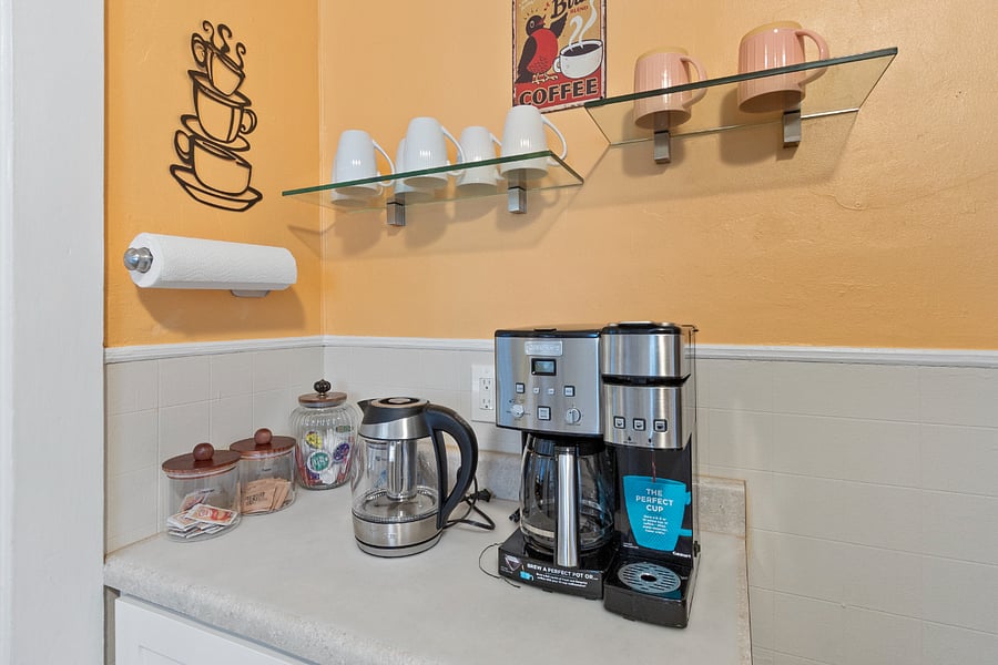 Coffee bar with starter items such as k-cup coffees and tea. Add sugar if you like.