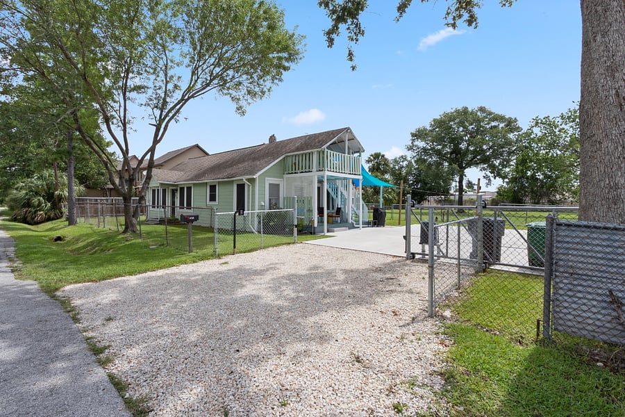 Driveway entrance with coded gate opener.